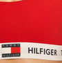 Tommy Hilfiger UNLINED BRALETTE Ladies Primary Red detail view showing logo and band.