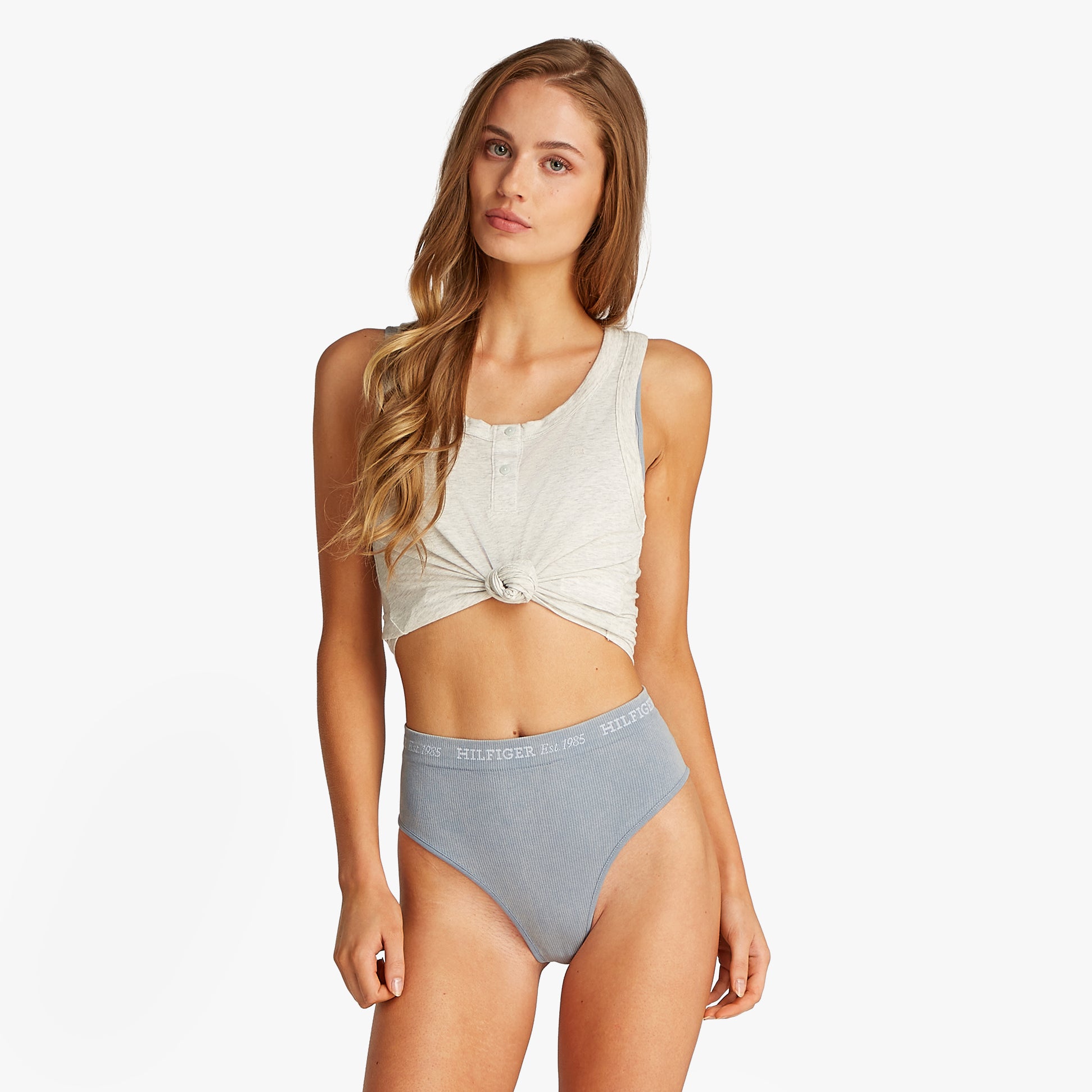 Tommy Hilfiger RIBBED Womens High Rise Briefs Brisk Blue front view on model wearing a grey top with knotted detail.