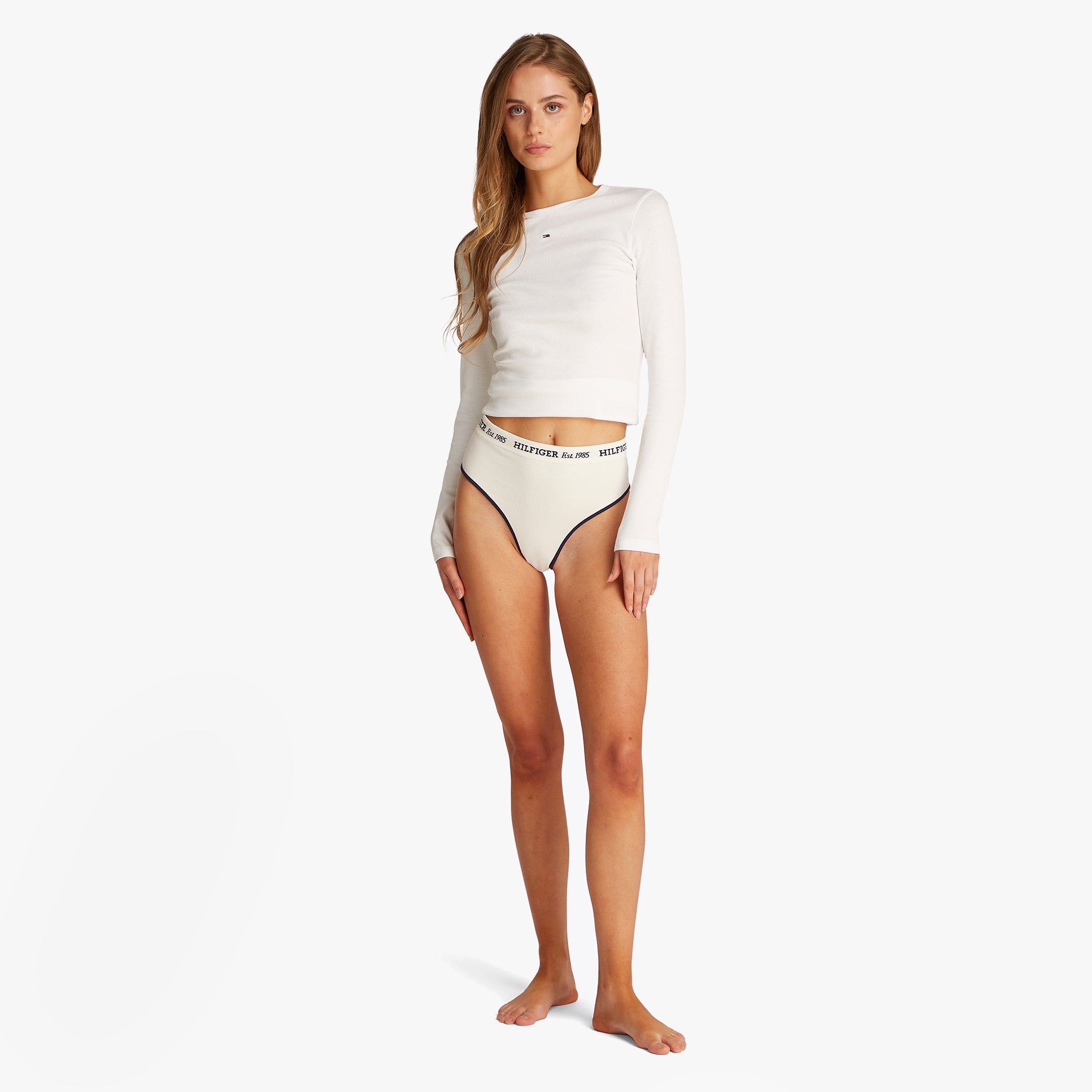 Tommy Hilfiger RIBBED Womens High Rise Briefs Ivory front view on model, showcasing ribbed texture and logo waistband.