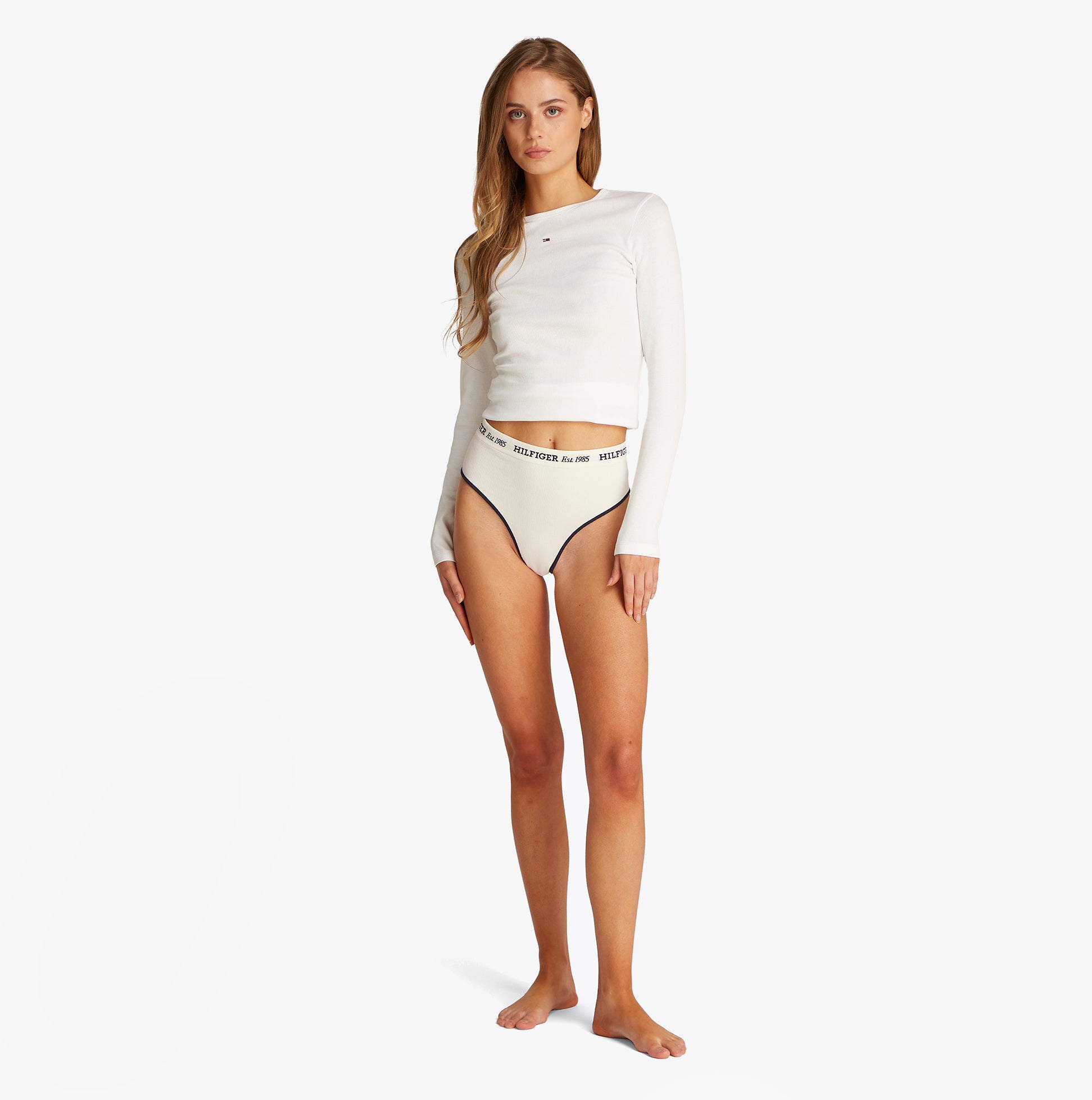 Tommy Hilfiger RIBBED Womens High Rise Briefs Ivory front view on model, showcasing ribbed texture and logo waistband.