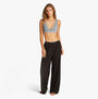 Tommy Hilfiger LOGO Womens Bralette Brisk Blue front view with black pants, showcasing ribbed texture and scoop V-neck design.