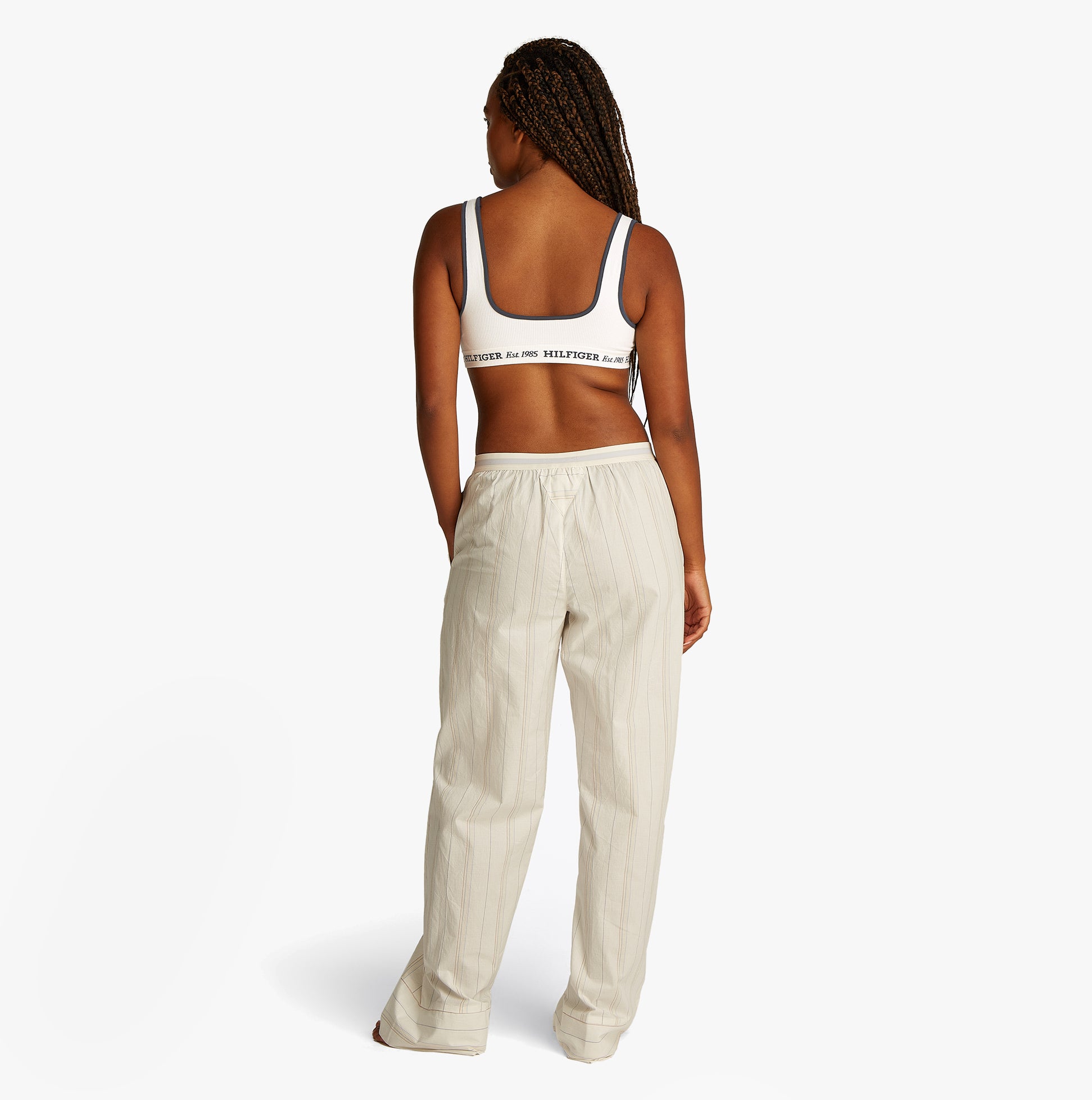 Tommy Hilfiger BRALETTE Womens Bikini Top Ivory back view with matching light-colored pants.