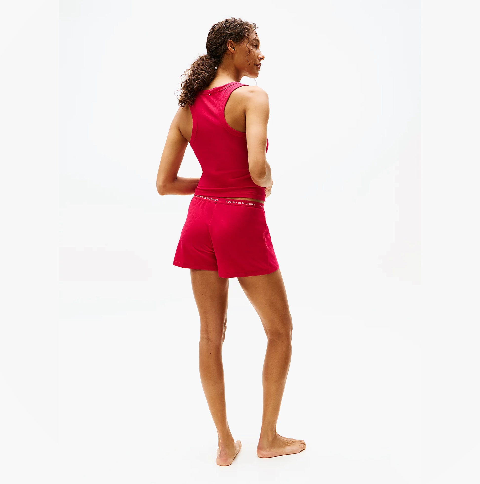 Tommy Hilfiger LOGO Womens Racerback Pyjama Set Vivacious Pink side view showing the back of the top and shorts.