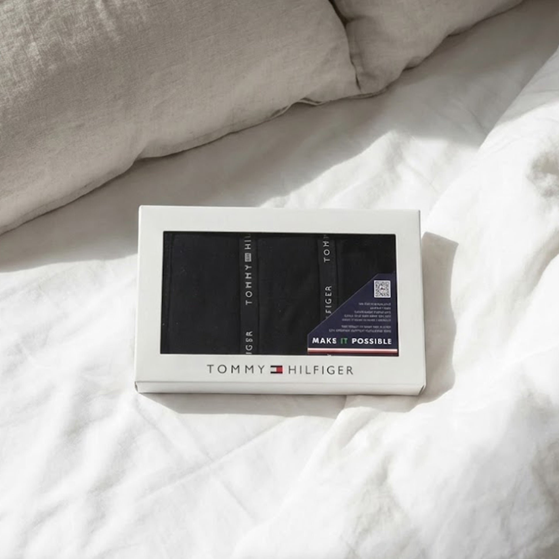 Tommy Hilfiger 3 PACK LACE Womens Thong Black in gift box, viewed from above on a bed with white bedding.