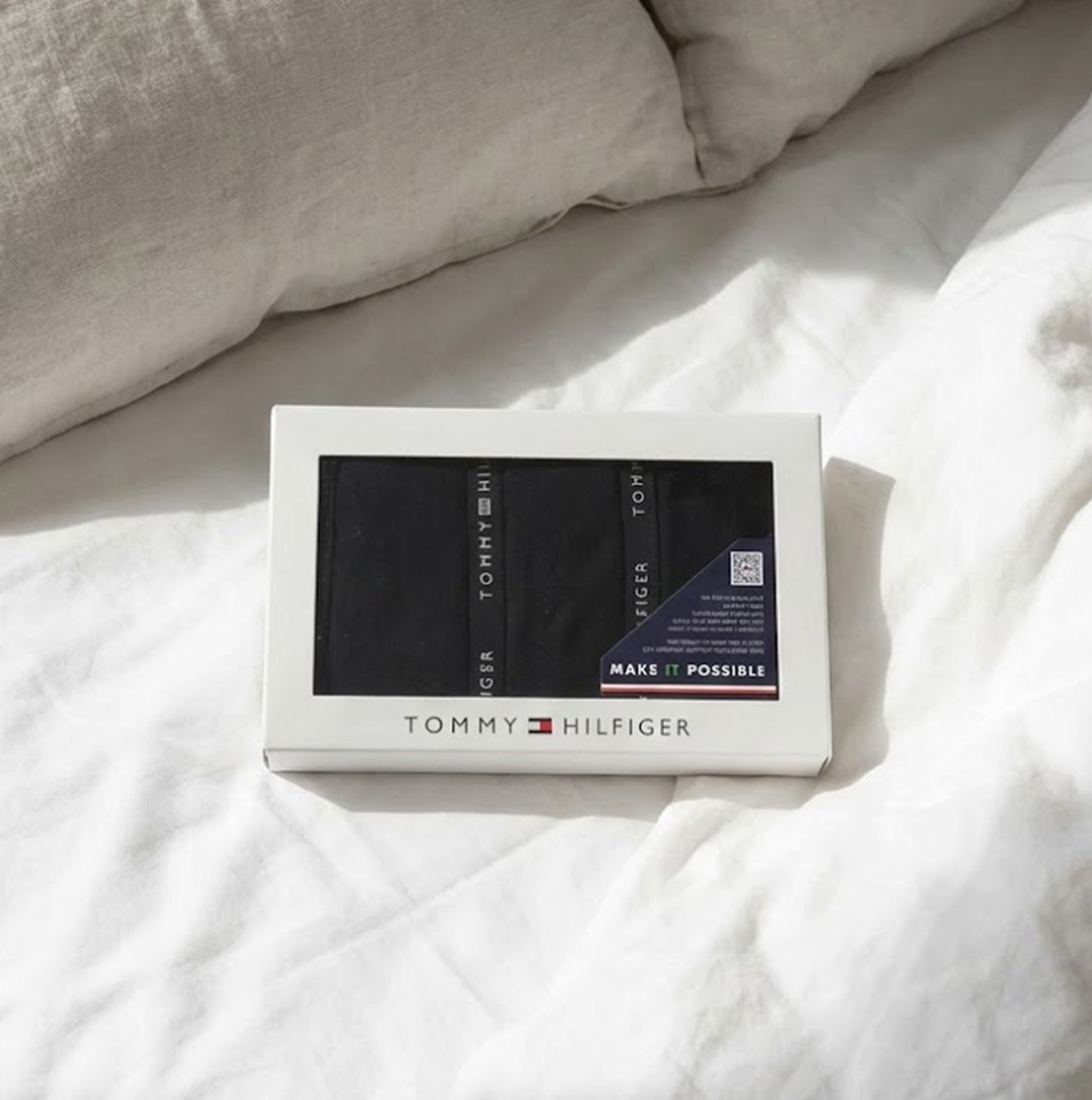Tommy Hilfiger 3 PACK LACE Womens Thong Black in gift box, viewed from above on a bed with white bedding.