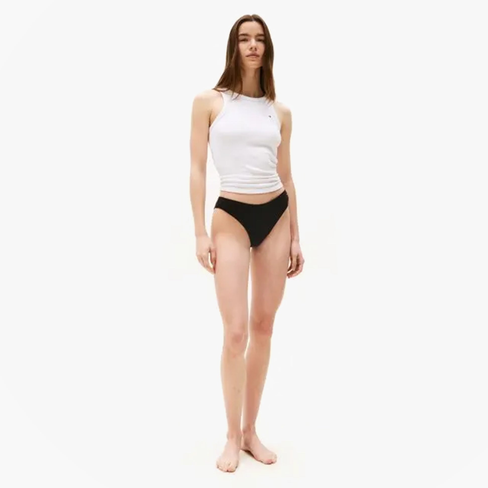 Tommy Hilfiger 3 PACK DIPPED BRAZIL Womens Briefs Brazilian Black on model, front view wearing black briefs with white top.