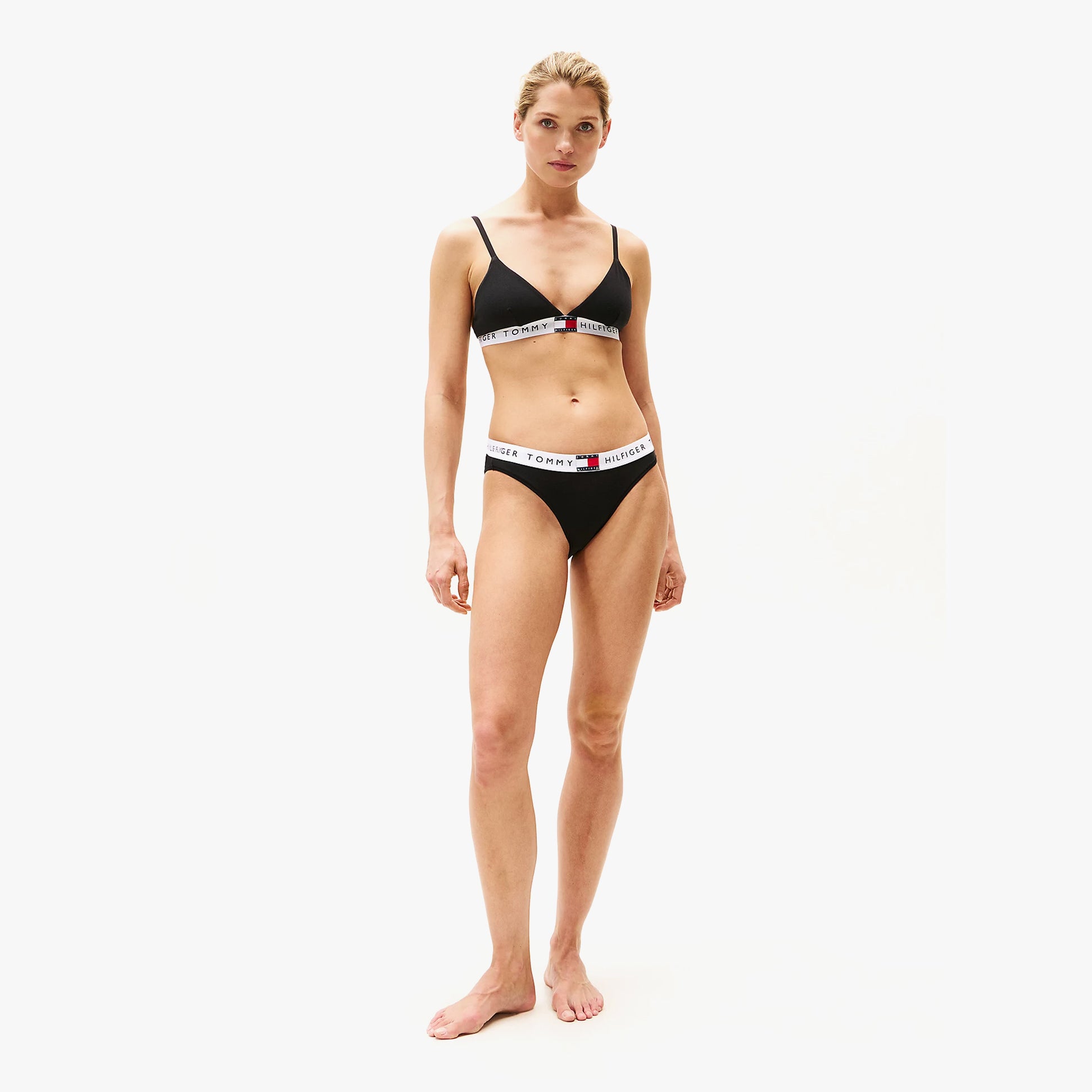 Tommy Hilfiger HERITAGE WAISTBAND Womens Logo Brief Black front view on model, showcasing stretch cotton and TH logo waistband.