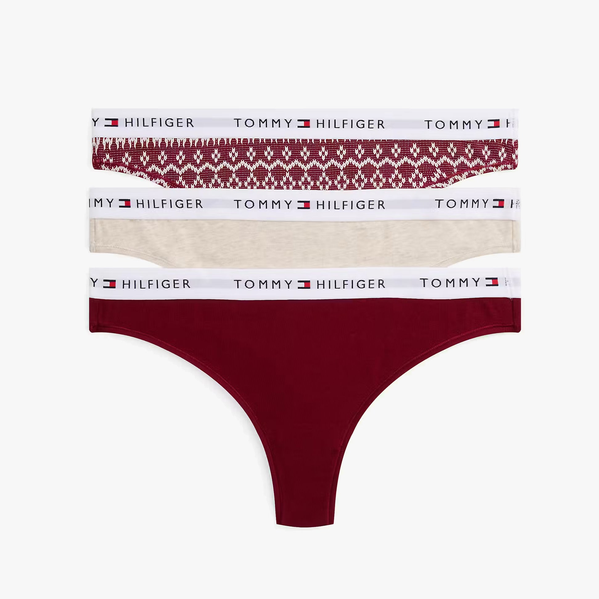 Tommy Hilfiger UW0UW06134 GIFT 3 PACK THONG PR Womens Thong Multicoloured top view showing 3 pack with red, beige and patterned designs.