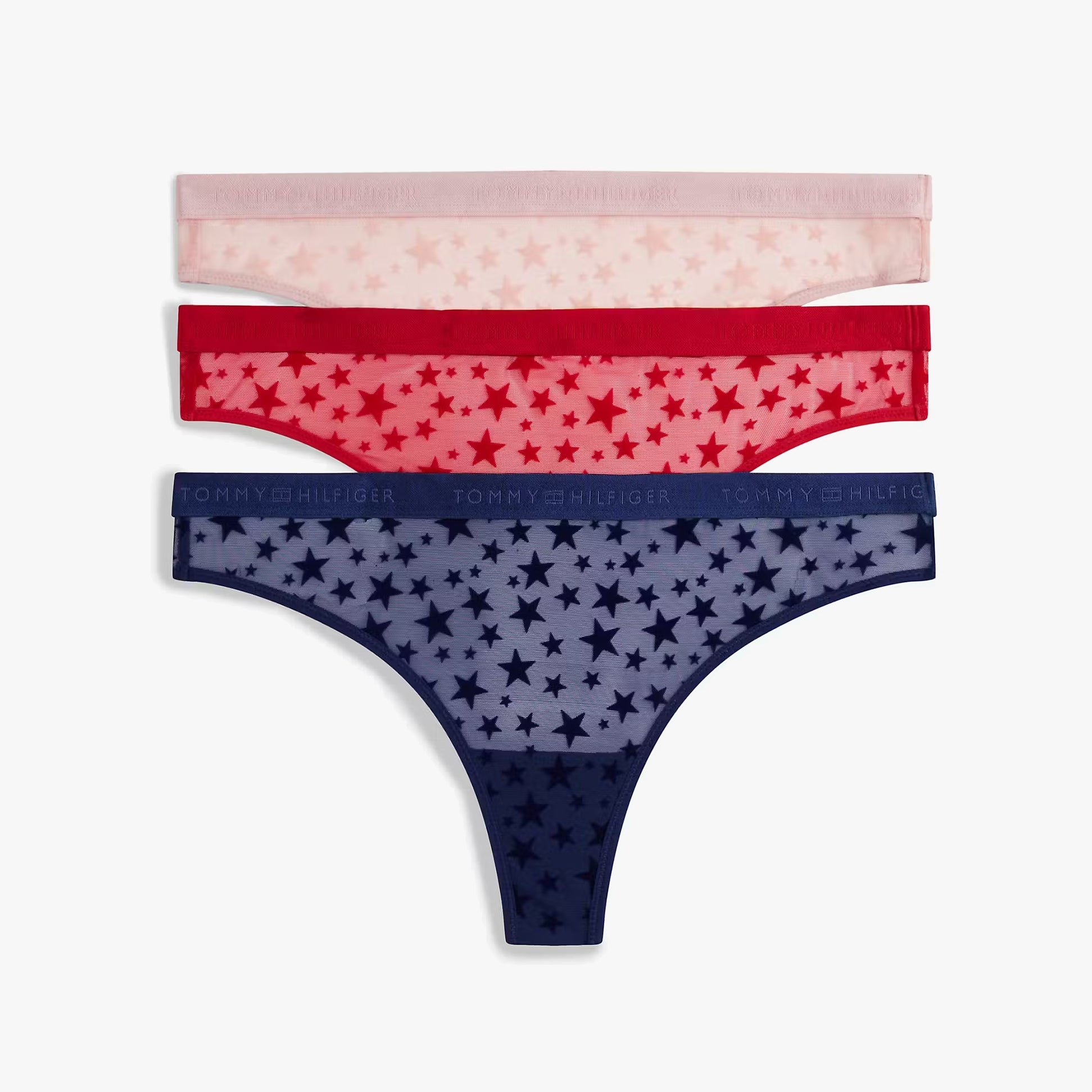 Tommy Hilfiger UW0UW06135 GIFT 3 PACK THONG Womens Thong Multicoloured, side view of 3-pack star-patterned thongs.