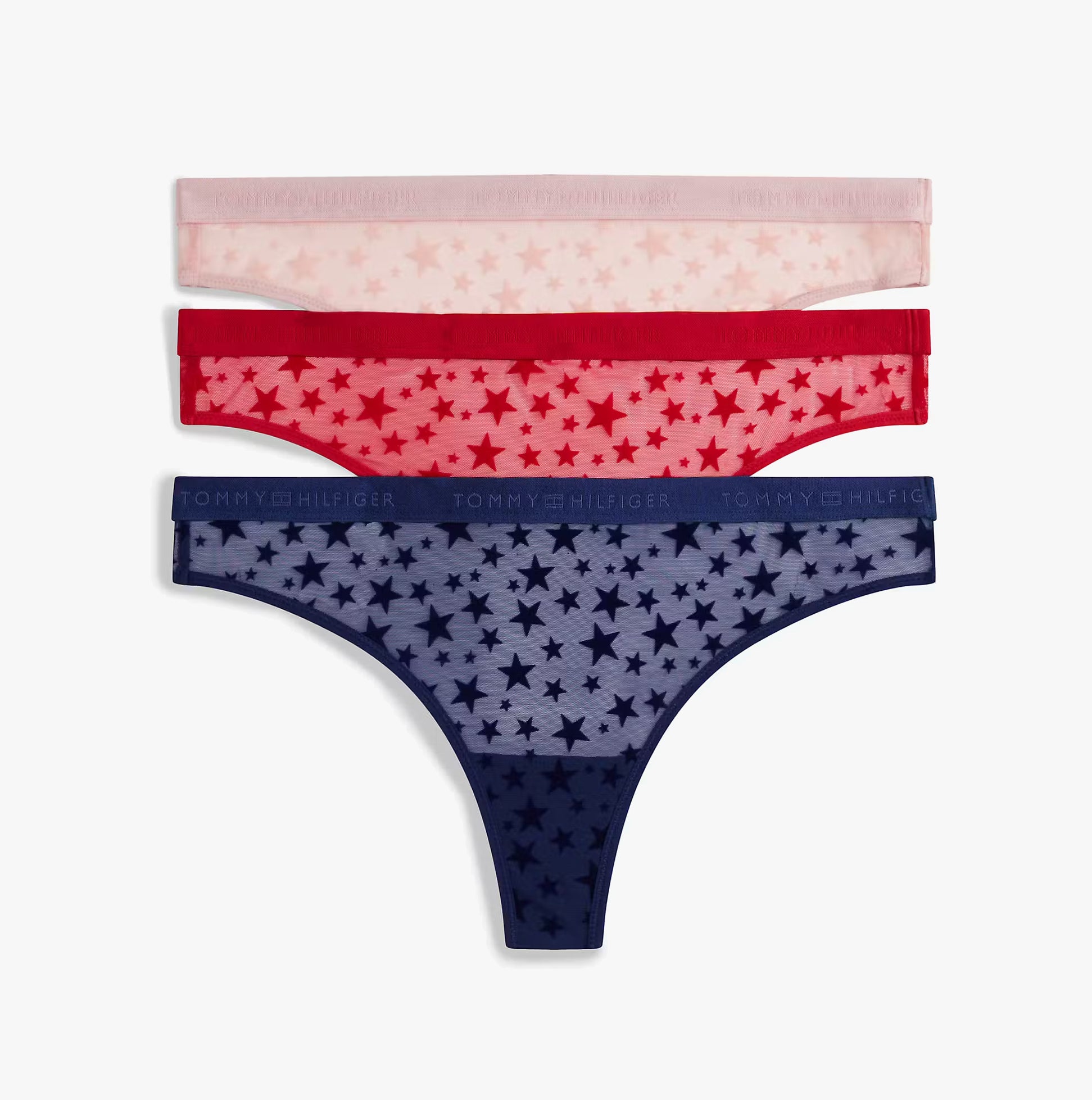 Tommy Hilfiger UW0UW06135 GIFT 3 PACK THONG Womens Thong Multicoloured, side view of 3-pack star-patterned thongs.