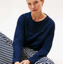 Tommy Hilfiger LS JERSEY RELAXED PJ Womens Set Multicoloured front view featuring a model in navy top and striped pants.