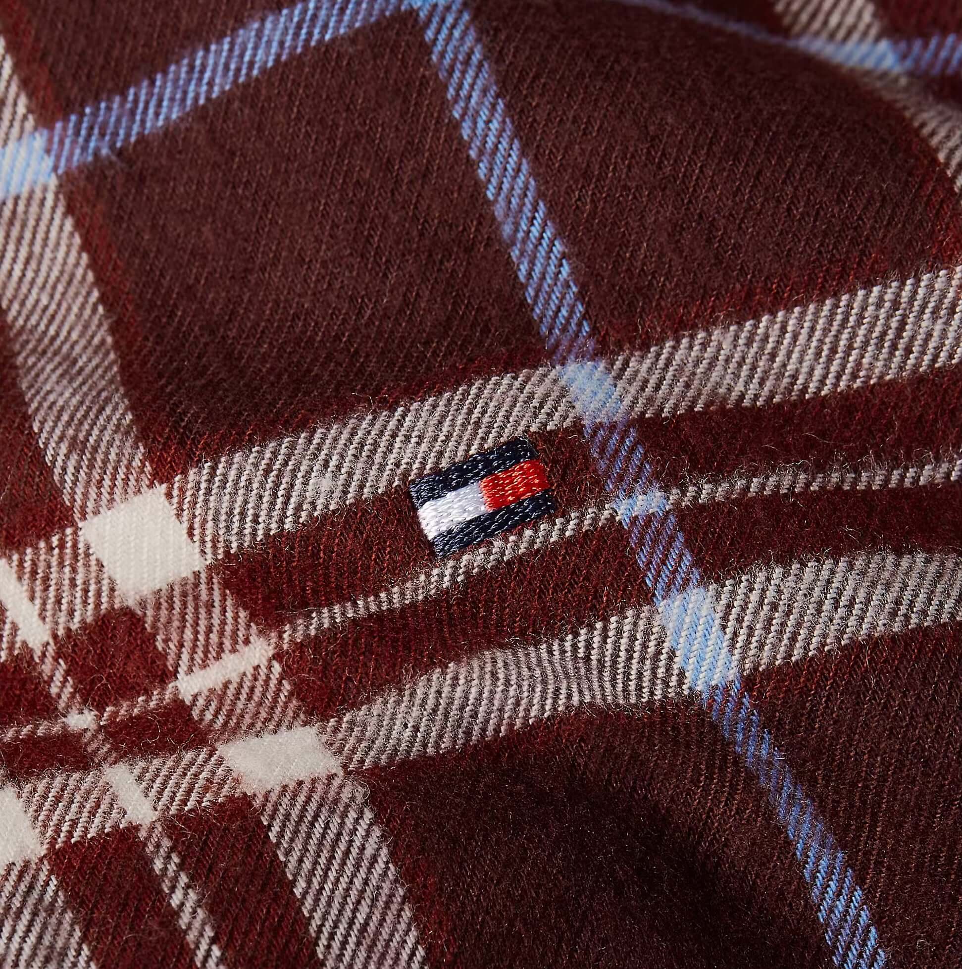Detail view of Tommy Hilfiger LS FLNL SHIRT PJ PAN Womens Set Tartan Reiker Burgundy fabric with logo.