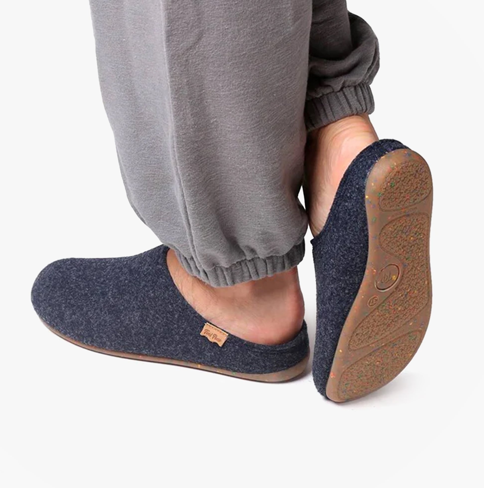 Toni Pons MONA-FR Womens Mari side view of slipper in navy felt, worn with grey pants, highlighting comfort and style.