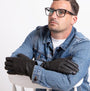 Totes Isotoner SMARTOUCH WATER REPELLENT 3 POINT LEATHER Mens Gloves Black worn by model in detail view.