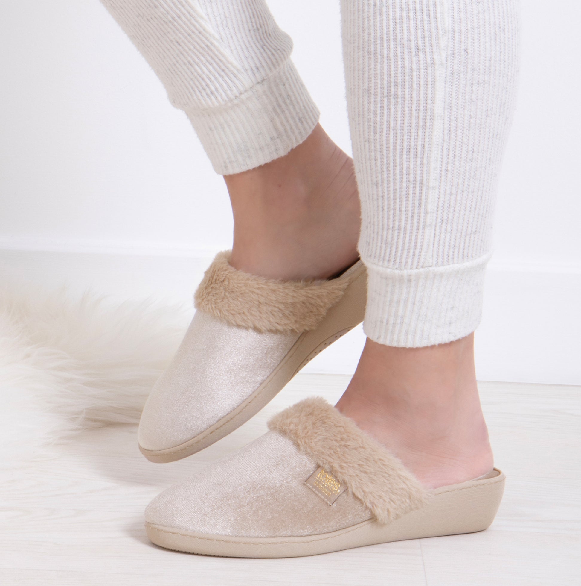 Totes Isotoner SPARKLE VELOUR HEELED MULE Womens Mule Slippers Mink side view on feet with cozy fabric lining.