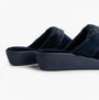 Totes Isotoner SPARKLE VELOUR HEELED MULE Womens Mule Slippers Navy side view showing soft velour upper and low heel.