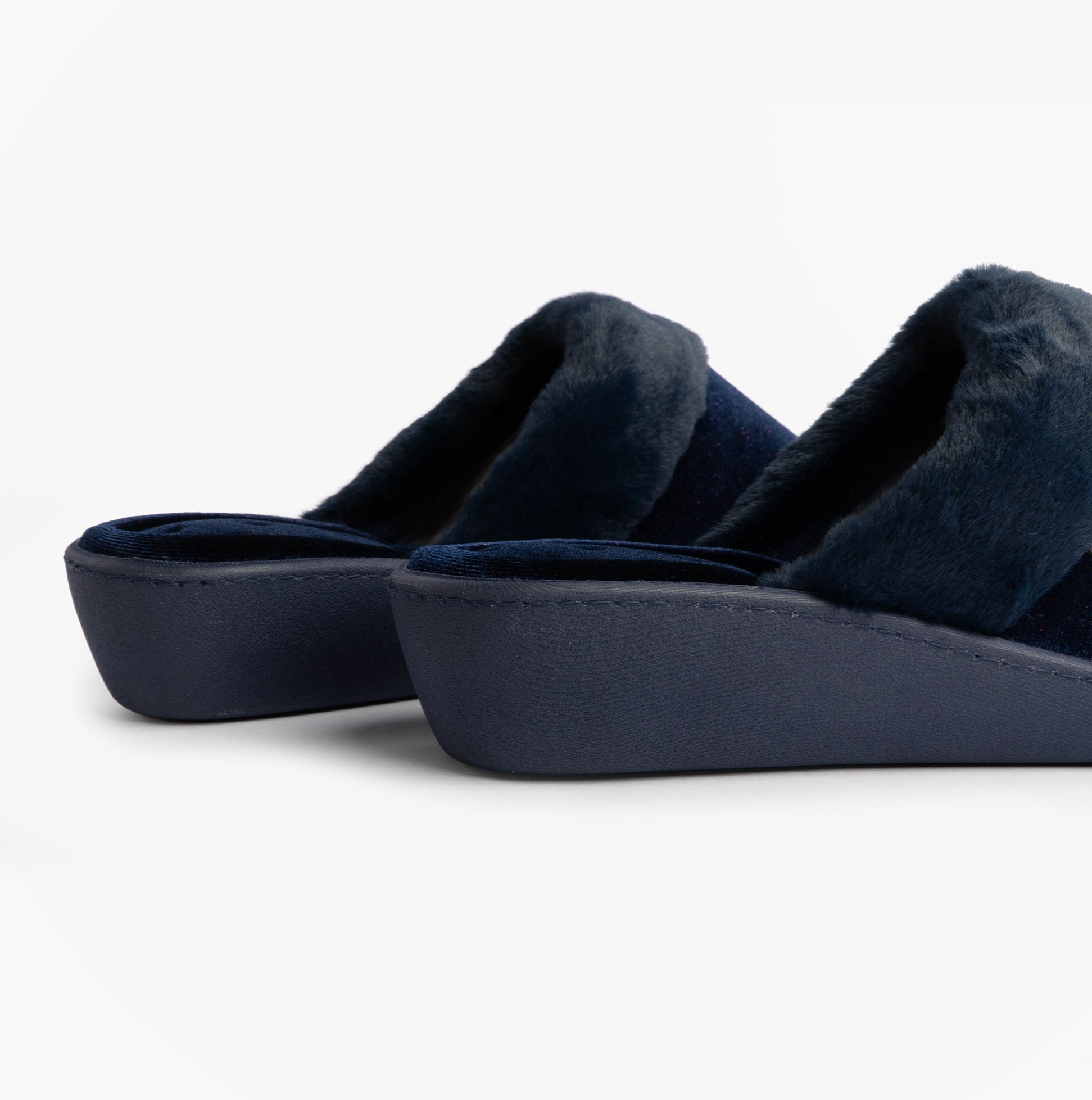 Totes Isotoner SPARKLE VELOUR HEELED MULE Womens Mule Slippers Navy side view showing soft velour upper and low heel.