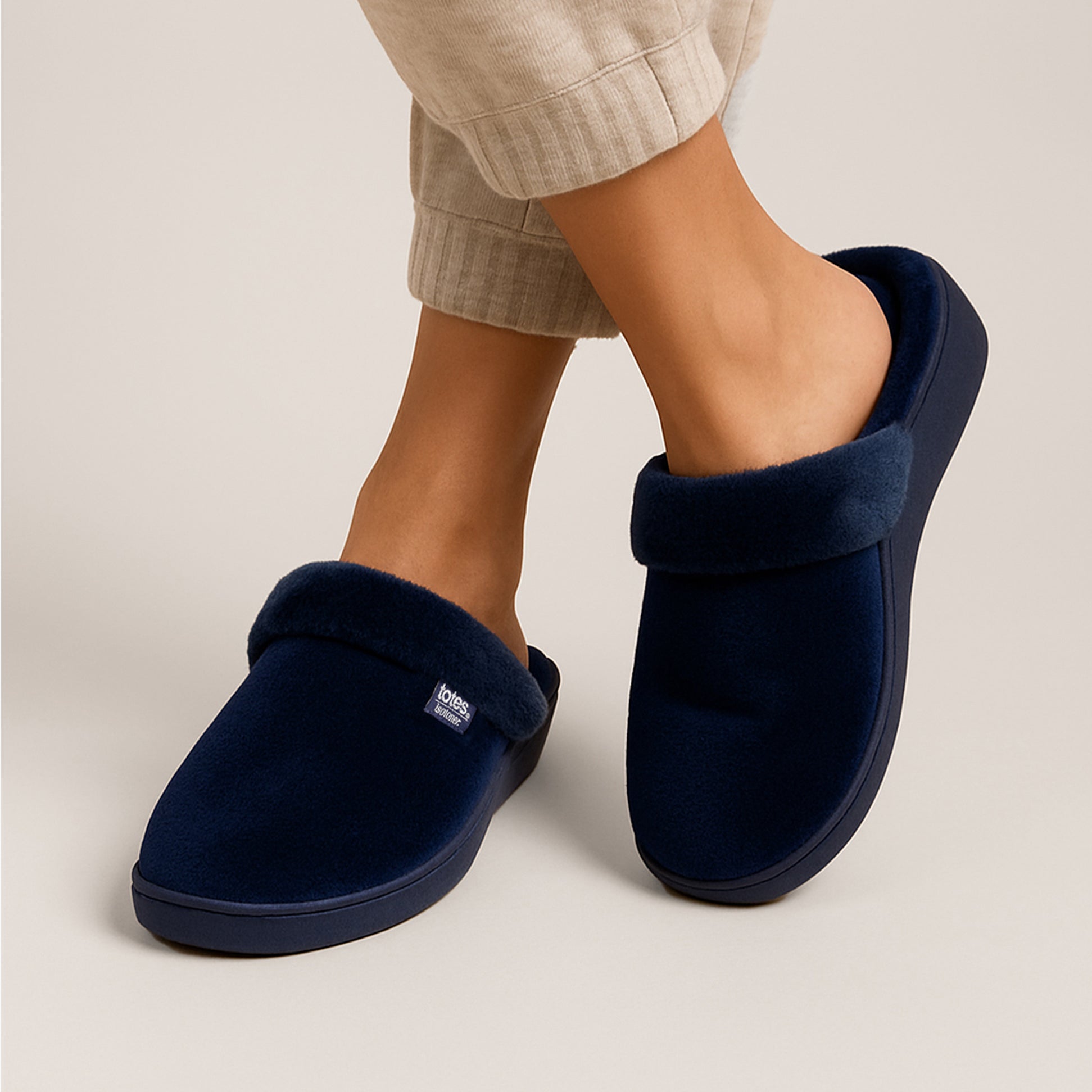 Totes Isotoner SPARKLE VELOUR HEELED MULE Womens Mule Slippers Navy side view displaying soft material and cozy design.