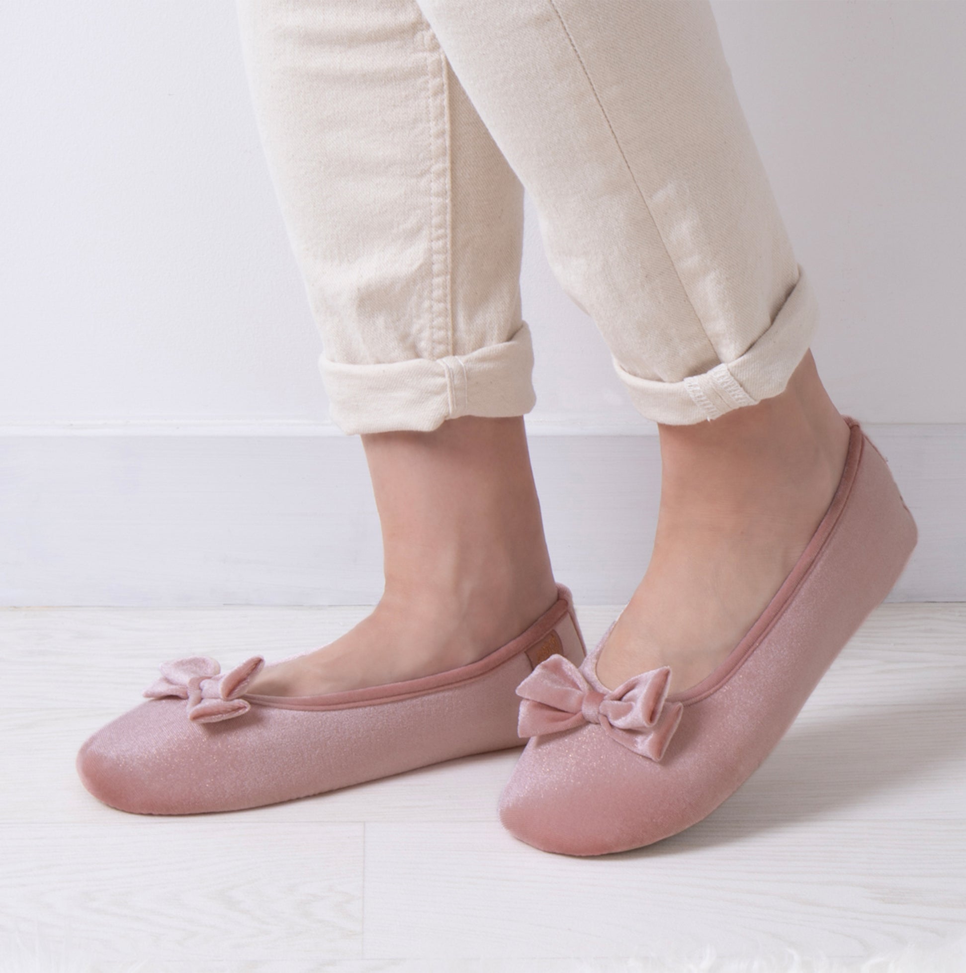 Totes Isotoner SPARKLE VELOUR BALLET Womens Ballet Slippers Pink side view worn with light pants