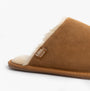 Totes Isotoner REAL SUEDE MULE Womens Slippers Tan side view showcasing soft suede upper and cozy lining.