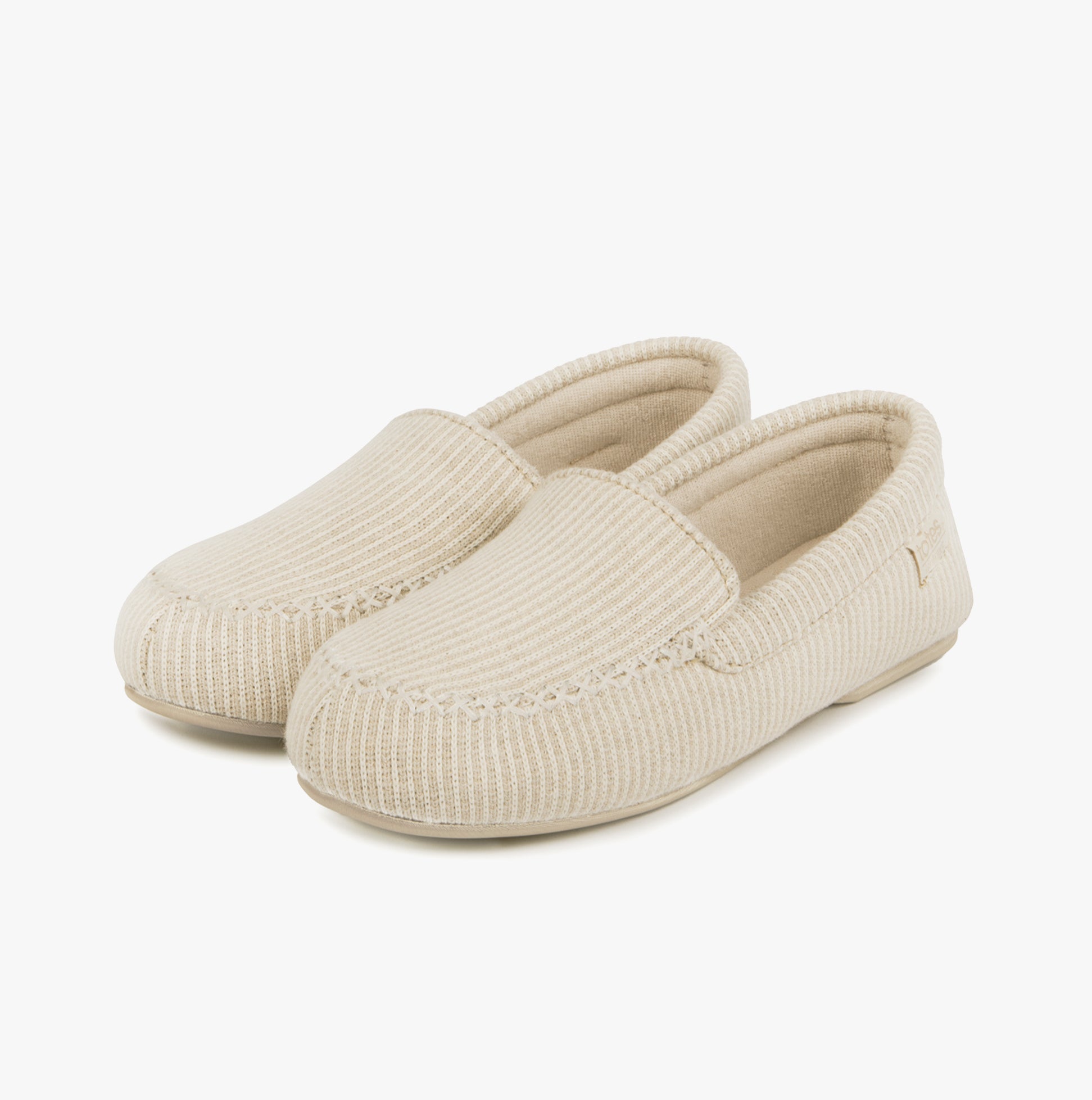 Totes Isotoner TEXTURED Womens Moccasin Slippers Beige side view showing textured fabric and slip-on design.