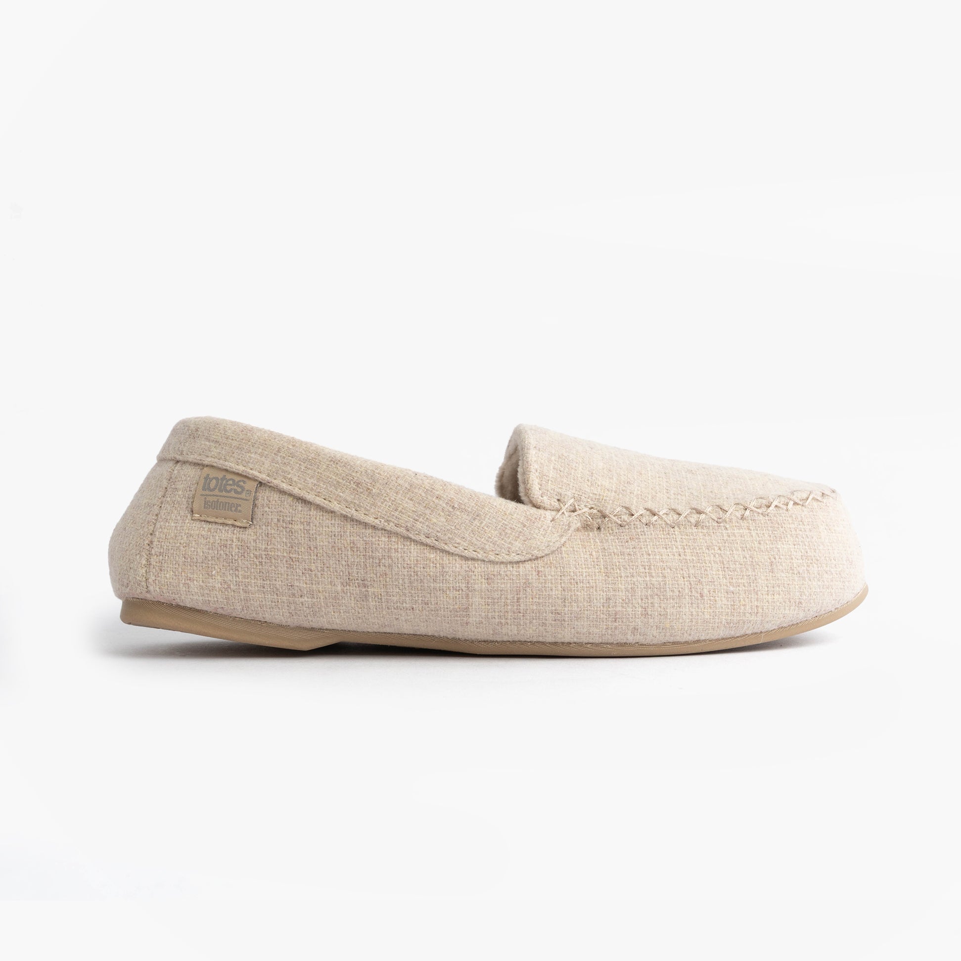 Totes Isotoner TEXTURED Womens Moccasin Slippers Light Brown side view showcasing the cotton upper and slip-on design.