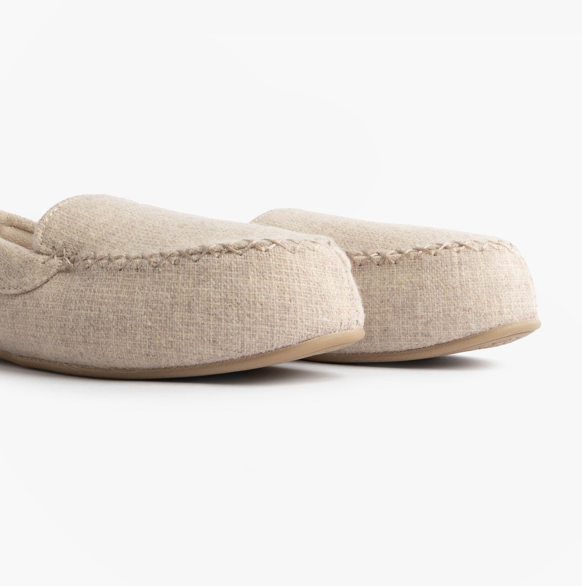 Totes Isotoner TEXTURED Womens Moccasin Slippers Light Brown side view showing soft fabric and slip-on design.