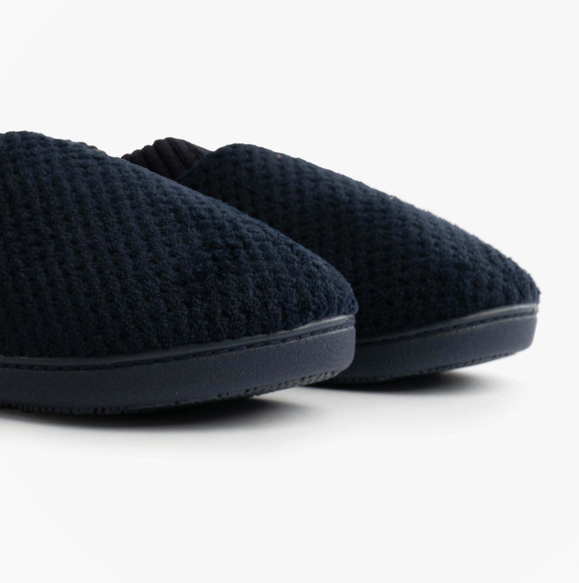 Totes Isotoner POPCORN FULL BACK BOOTIE Womens Slippers Navy, side view showing textured upper and flat sole.