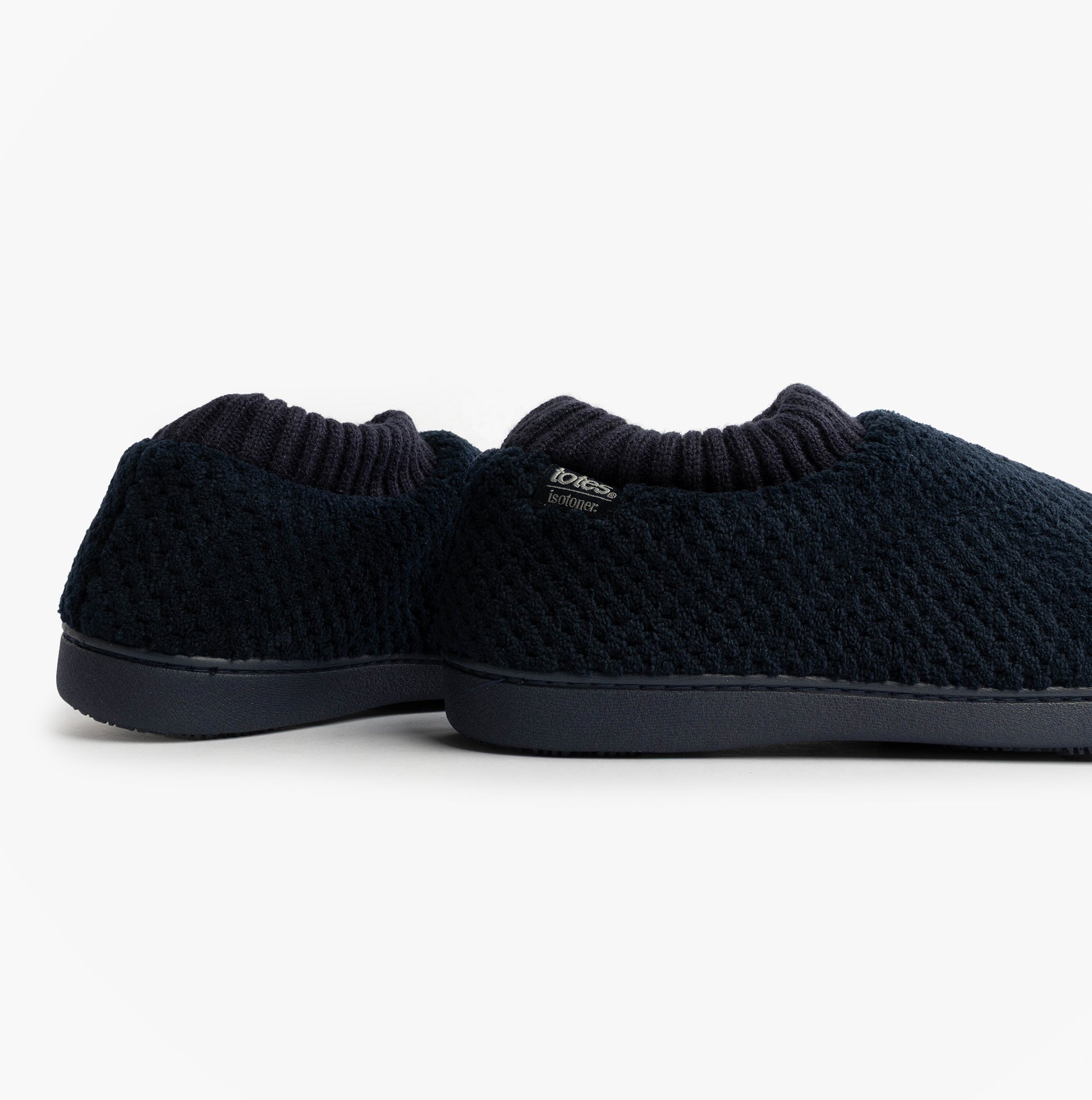 Totes Isotoner POPCORN FULL BACK BOOTIE Womens Slippers Navy side view showing soft, knitted upper and slip-on design.
