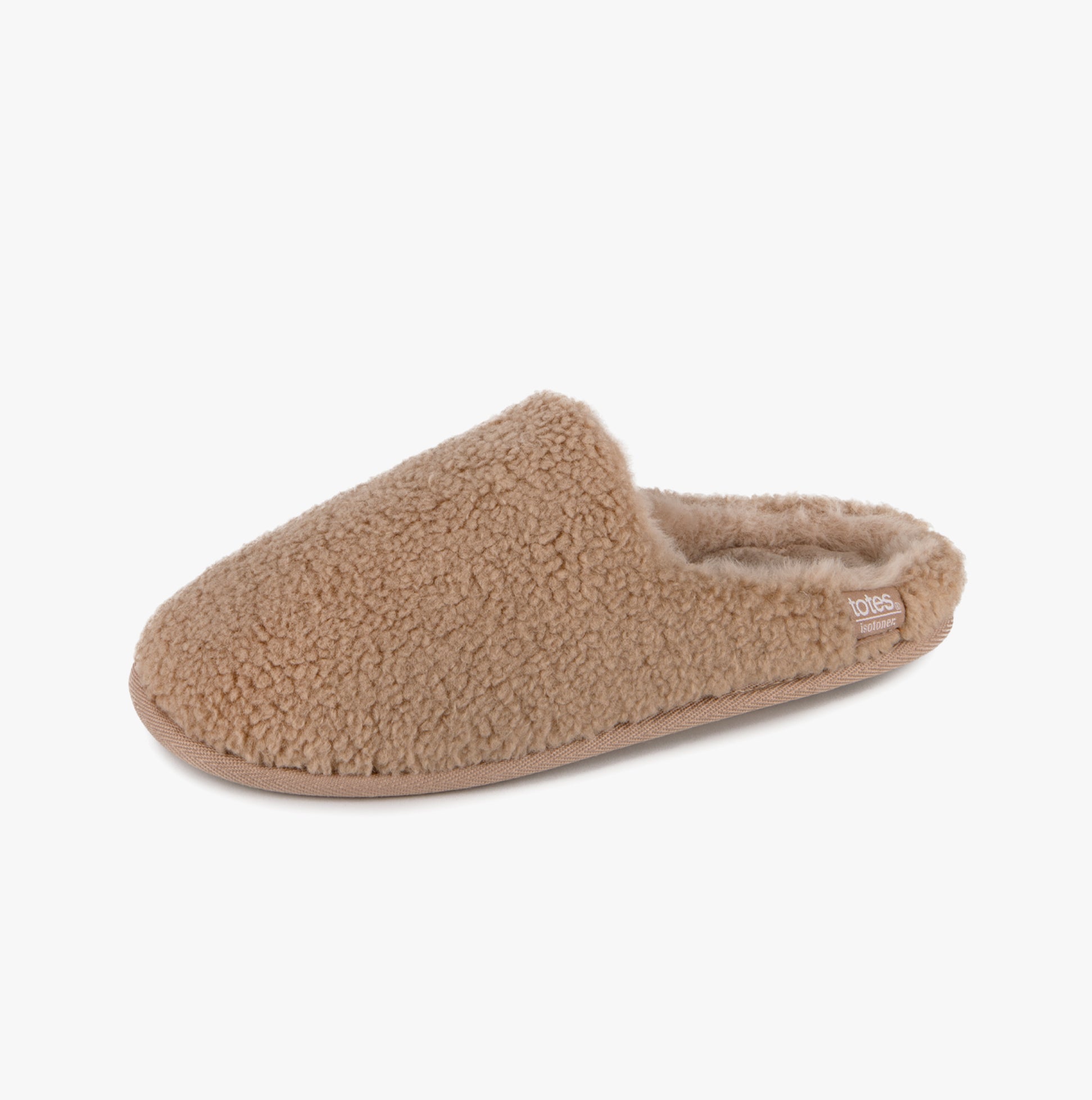 Totes Isotoner CURLY FUR MULE Womens Mule Slippers Natural side view showing soft faux fur design and slip-on style.