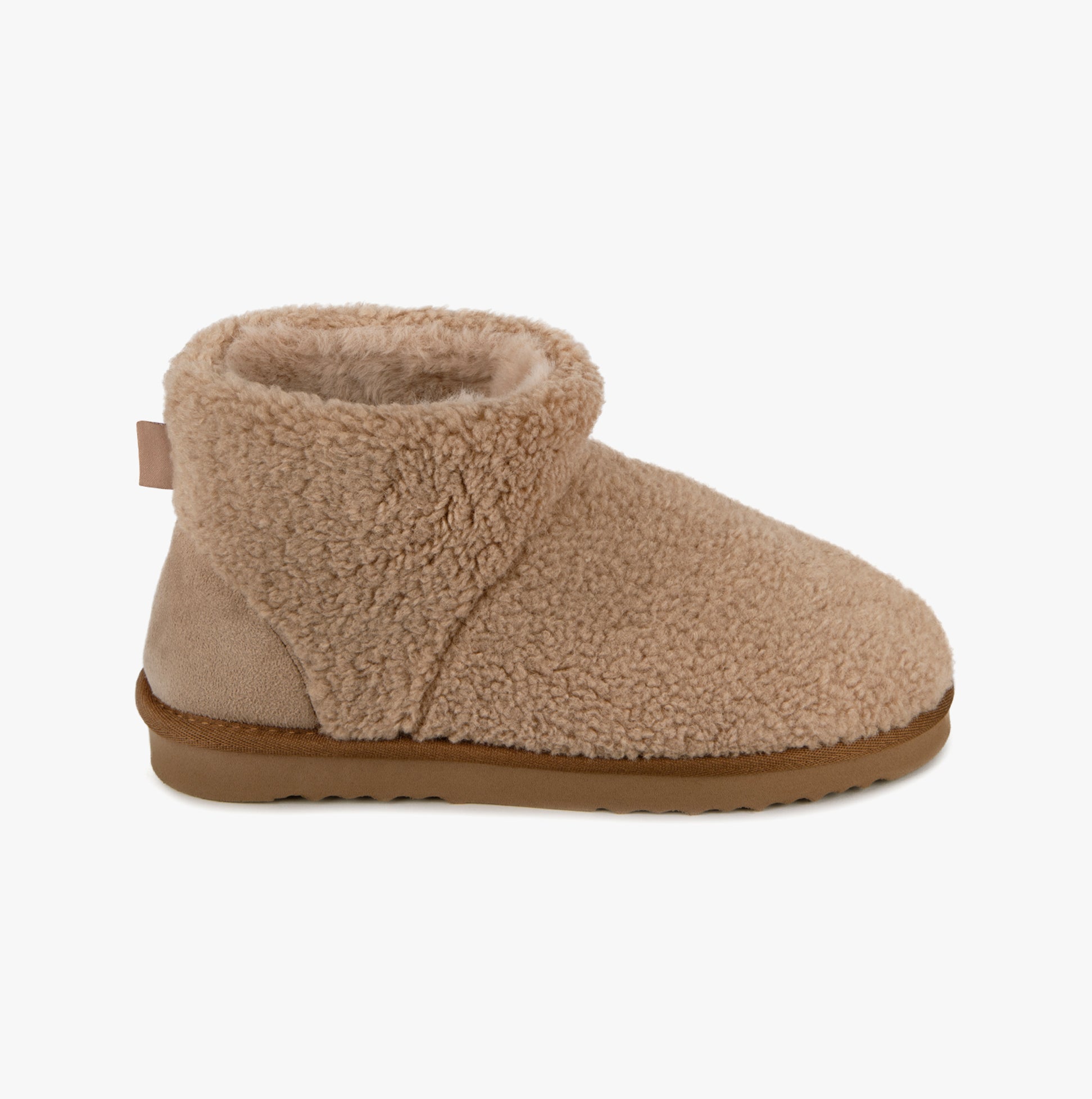 Totes Isotoner CURLY FUR BOOT Womens Bootie Slippers Natural side view showing soft curly fur material and ankle height design.