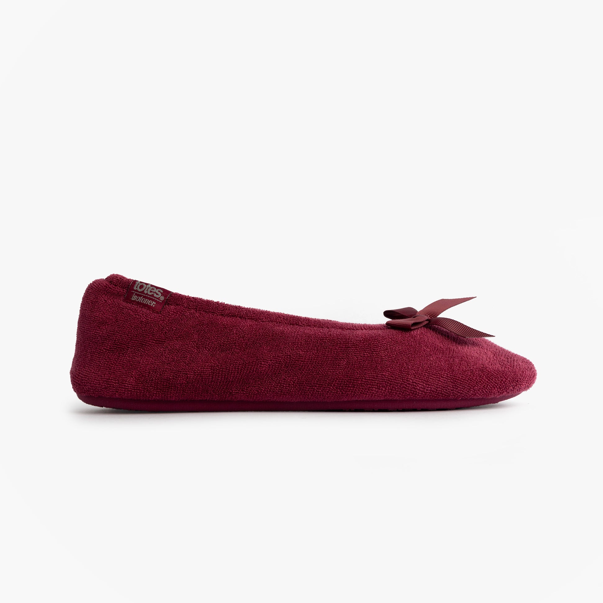 Totes Isotoner STRETCH TERRY BOW Womens Ballerina Slippers Burgundy side view, featuring soft terry fabric and a decorative bow.