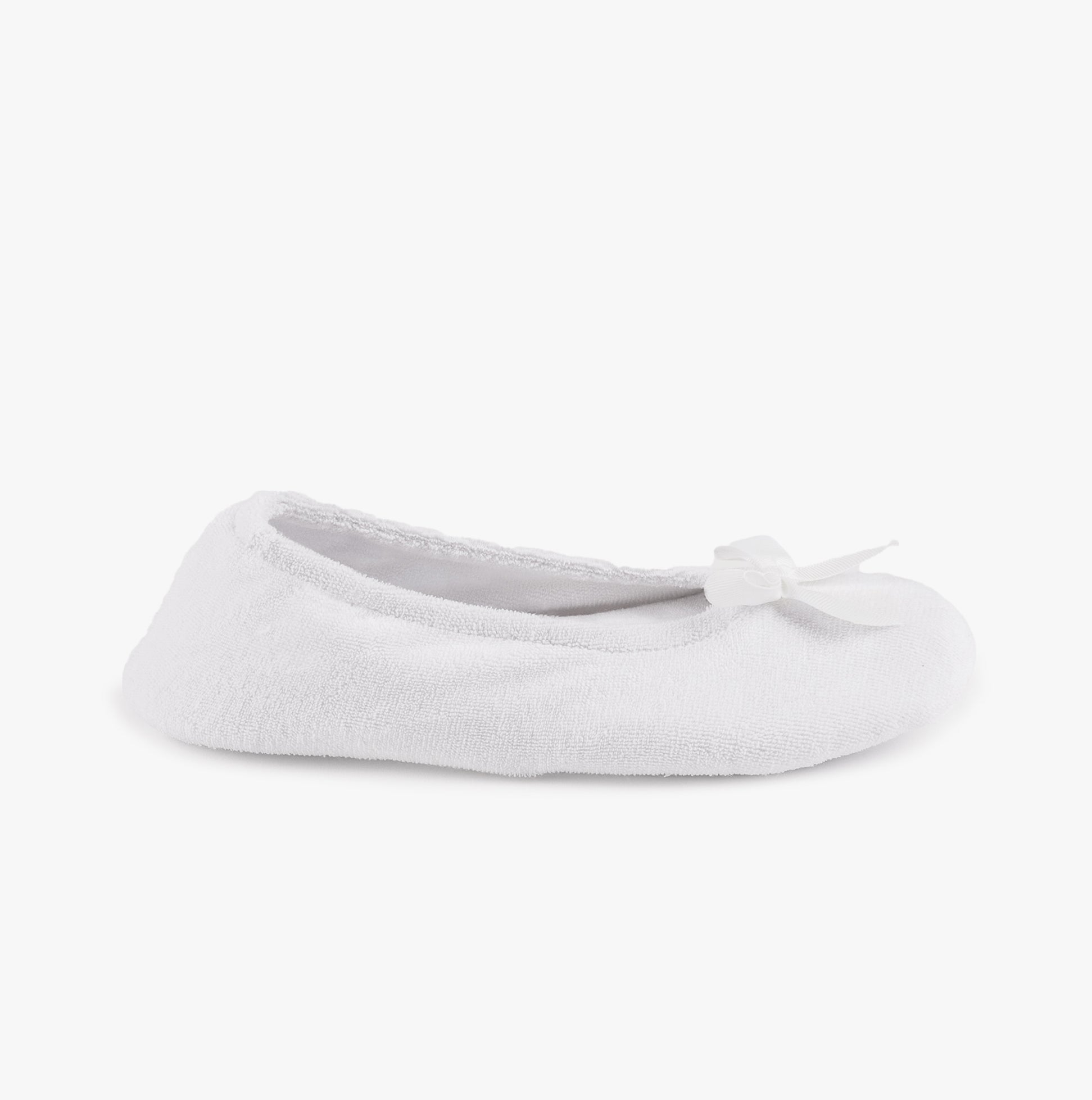 Totes Isotoner STRETCH TERRY BOW Womens Ballerina Slippers White side view, showcasing the soft terry fabric and bow design.