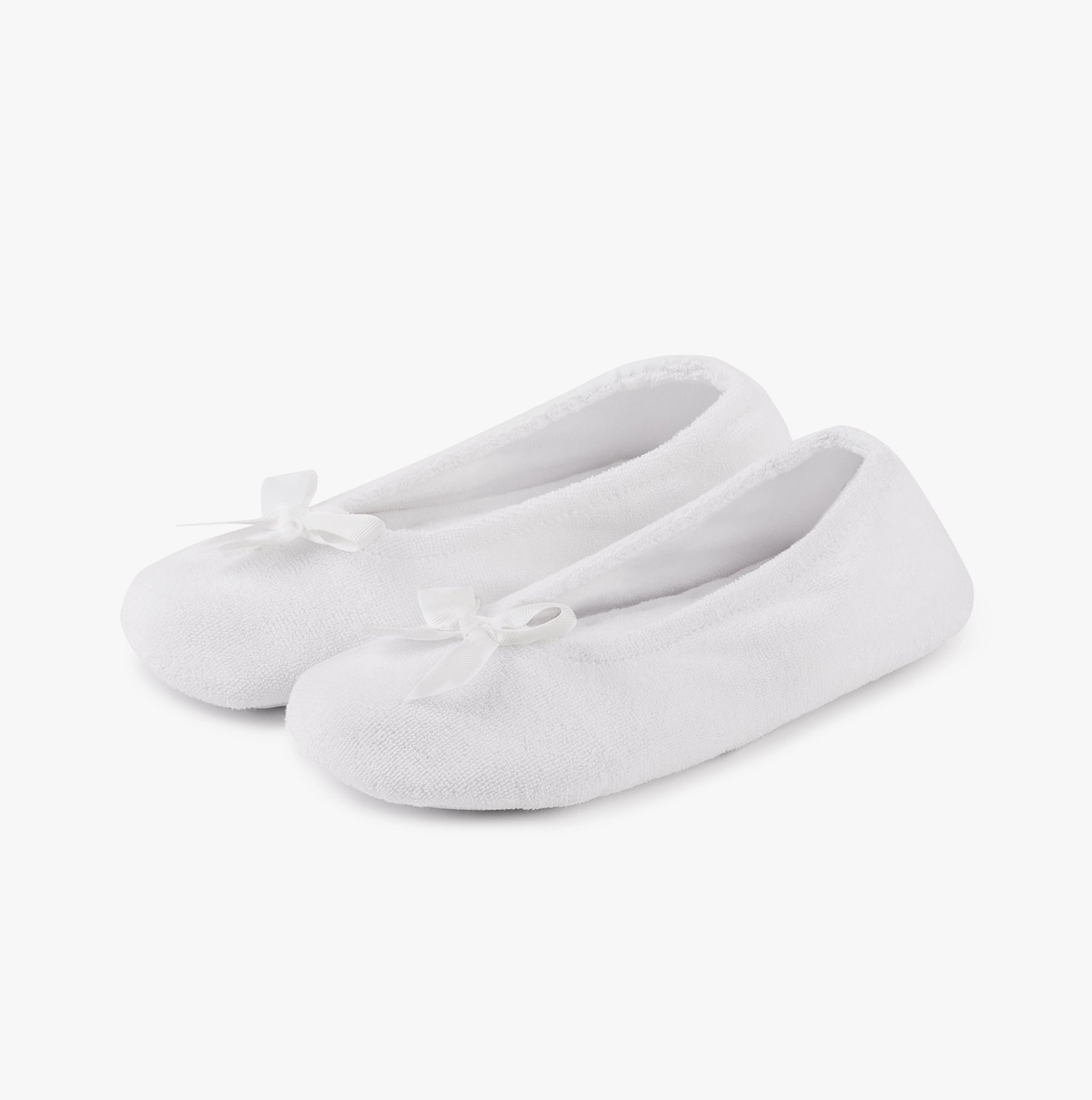 Totes Isotoner STRETCH TERRY BOW Womens Ballerina Slippers White side view with decorative bow detail.