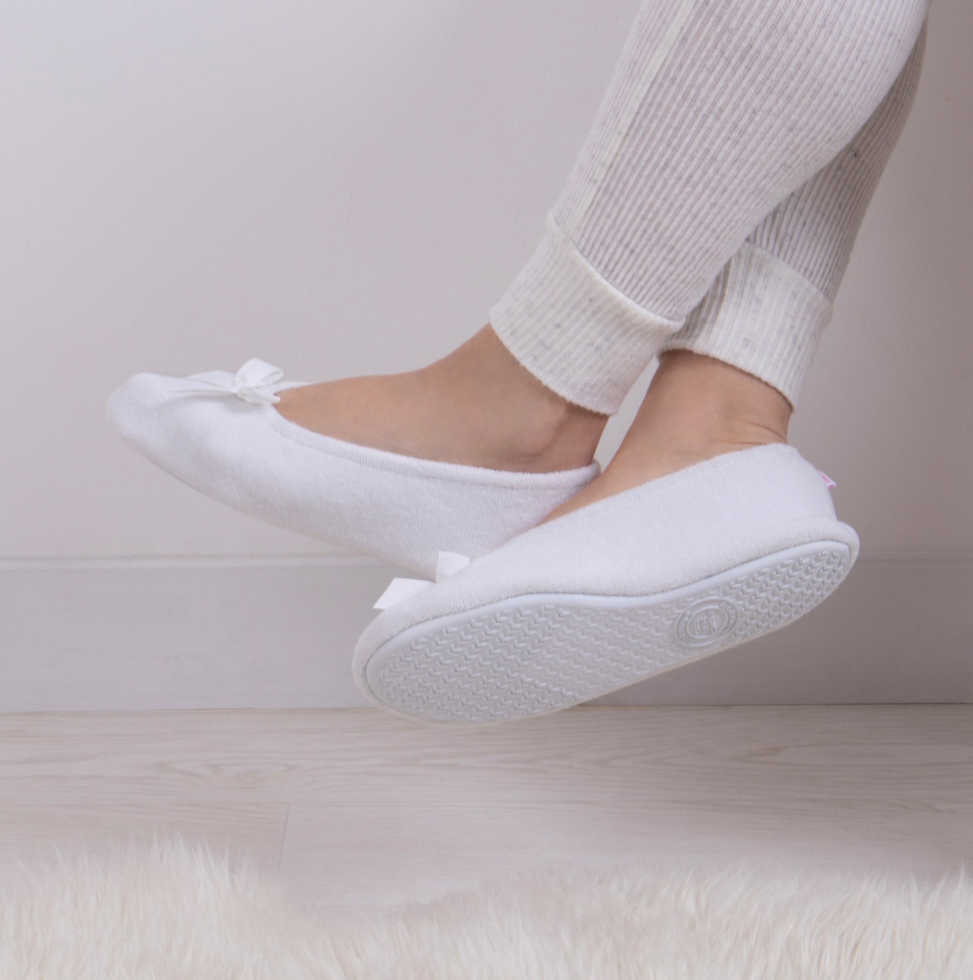 Totes Isotoner STRETCH TERRY BOW Womens Ballerina Slippers White side view with bow detail on soft cotton upper.