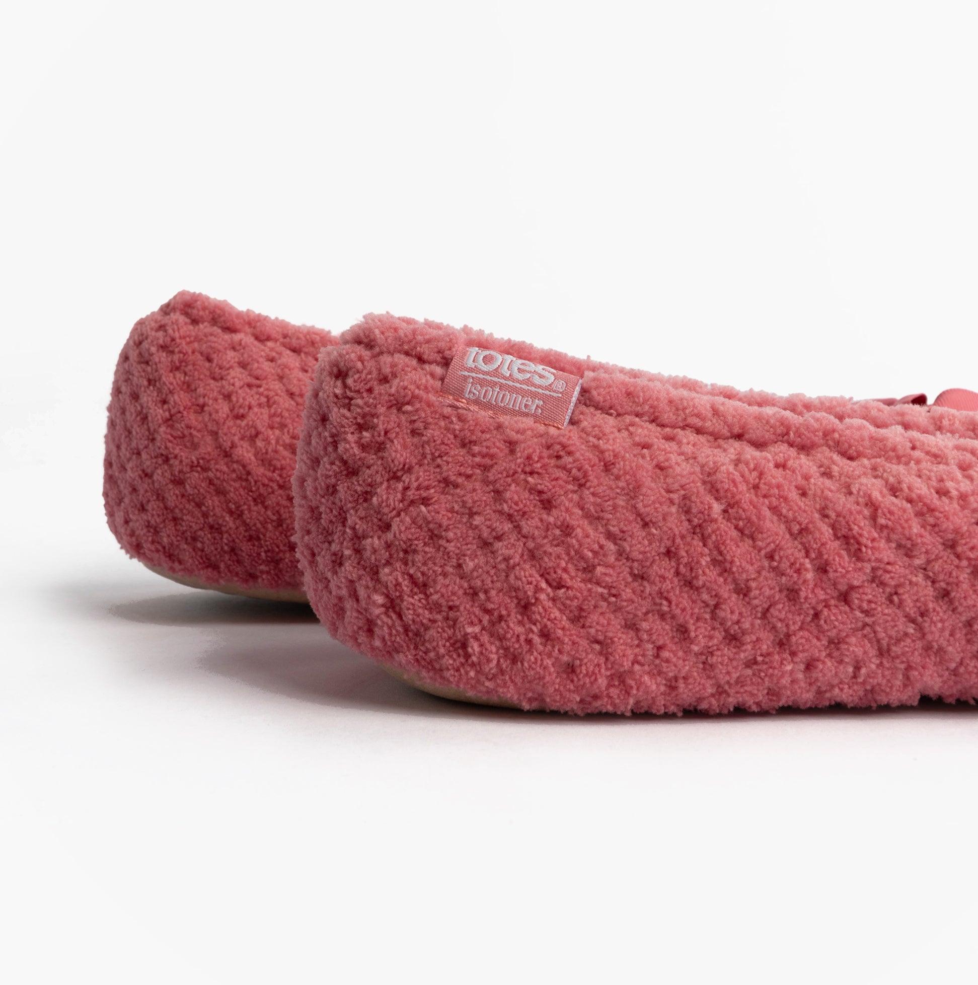 Totes Isotoner POPCORN BALLET Womens Ballerina Slippers Bright Pink rear side view with textured fabric and logo tag.
