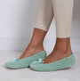 Totes Isotoner POPCORN BALLET Womens Ballerina Slippers Mint side view on model's feet with light green color.