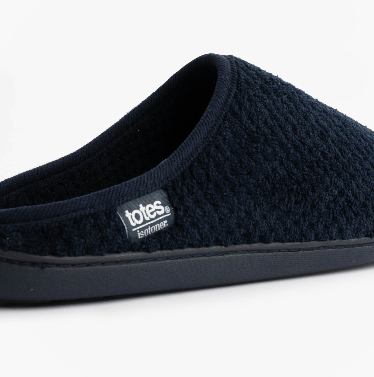Totes Isotoner SWEPT BACK POPCORN MULE Mens Mule Slippers Navy side view, soft polyester upper and slip-on design.