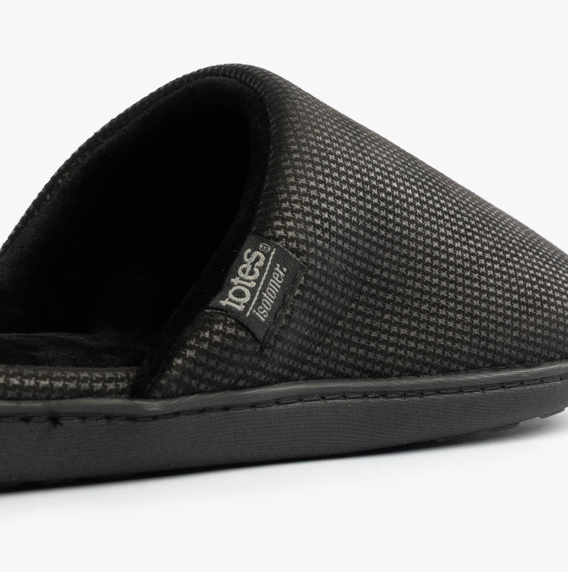 Totes Isotoner SQUARE PATTERNED SMART MULE Mens Mule Slippers Black side view highlighting pattern and comfort.