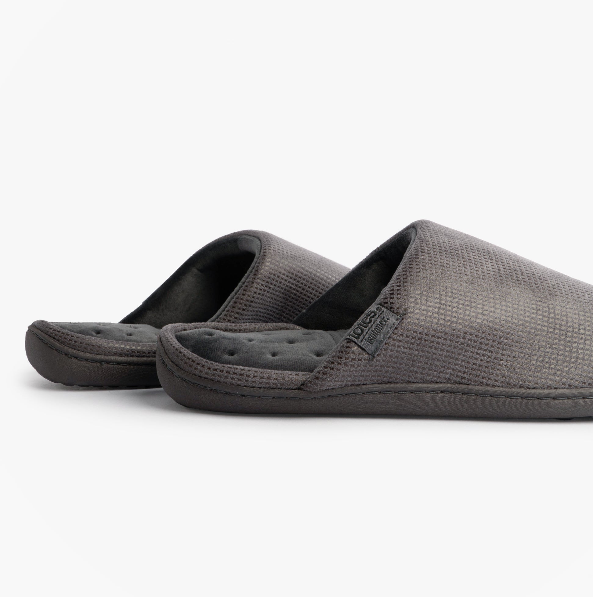 Totes Isotoner SQUARE PATTERNED SMART MULE Mens Mule Slippers Grey side view showing comfortable slip-on design.