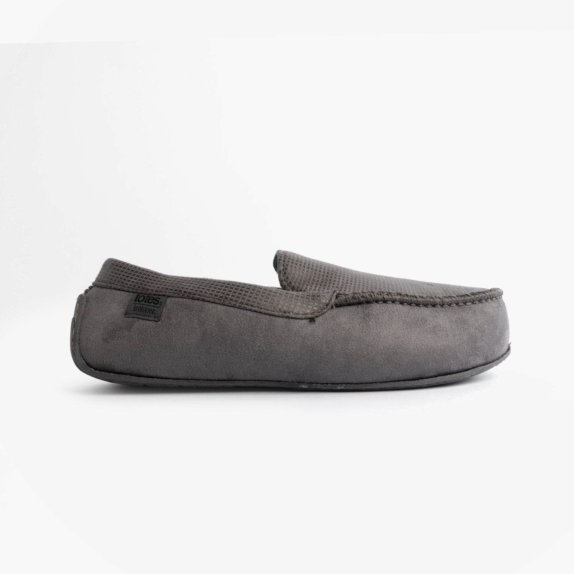 Totes Isotoner SQUARE PATTERNED SMART MOCCASIN Mens Moccasin Slippers Grey side view showing soft upper and round toe design.
