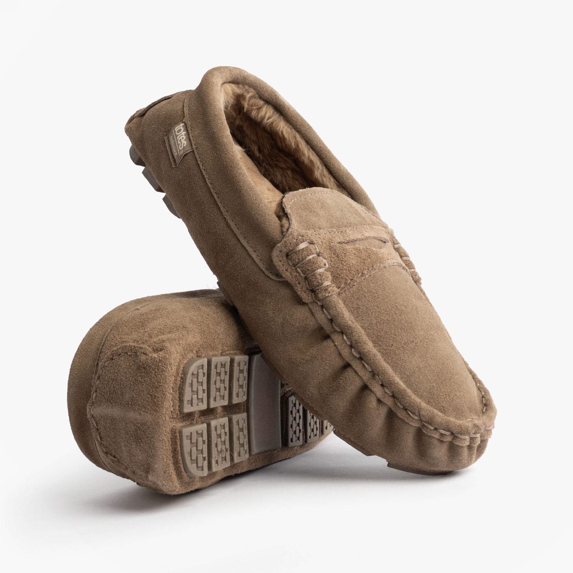Totes Isotoner SUEDE CLASSIC Moccasin Slippers Mens Sand side view and bottom view showcasing suede material and round toe design.