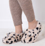 Totes Toasties NOVELTY FAUX FUR Slippers Womens Dalmatian side view on model's feet with cozy outfit.