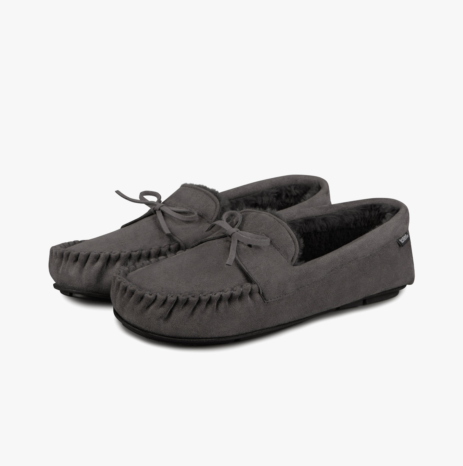 Totes Toasties SUEDETTE MOCCASIN Slippers WITH FAUX FUR LINING Mens Grey side view showing suede upper and faux fur lining.