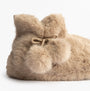 Totes Toasties FAUX FUR Boot Slippers Womens Oat side view showcasing soft faux fur and decorative pom poms.