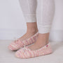 Totes Toasties KNITTED BALLET Slippers Womens Pink side view worn with light-colored leggings.