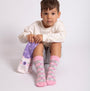 Totes Toasties ORIGINAL SLIPPER-SOX (Twin Pack) Kids Polar Bear/Fair Isle side view of child wearing colorful socks.