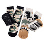 Totes Toasties ORIGINAL SLIPPER-SOX (Twin Pack) Kids Dino/Camo side view with slip-resistant treads and novelty designs.