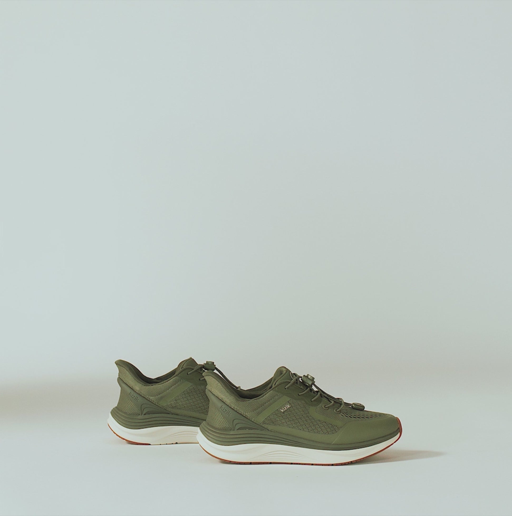 Kizik LONDON Mens Trainers Mayfly side view in olive green with lace-up closure and low-top design.