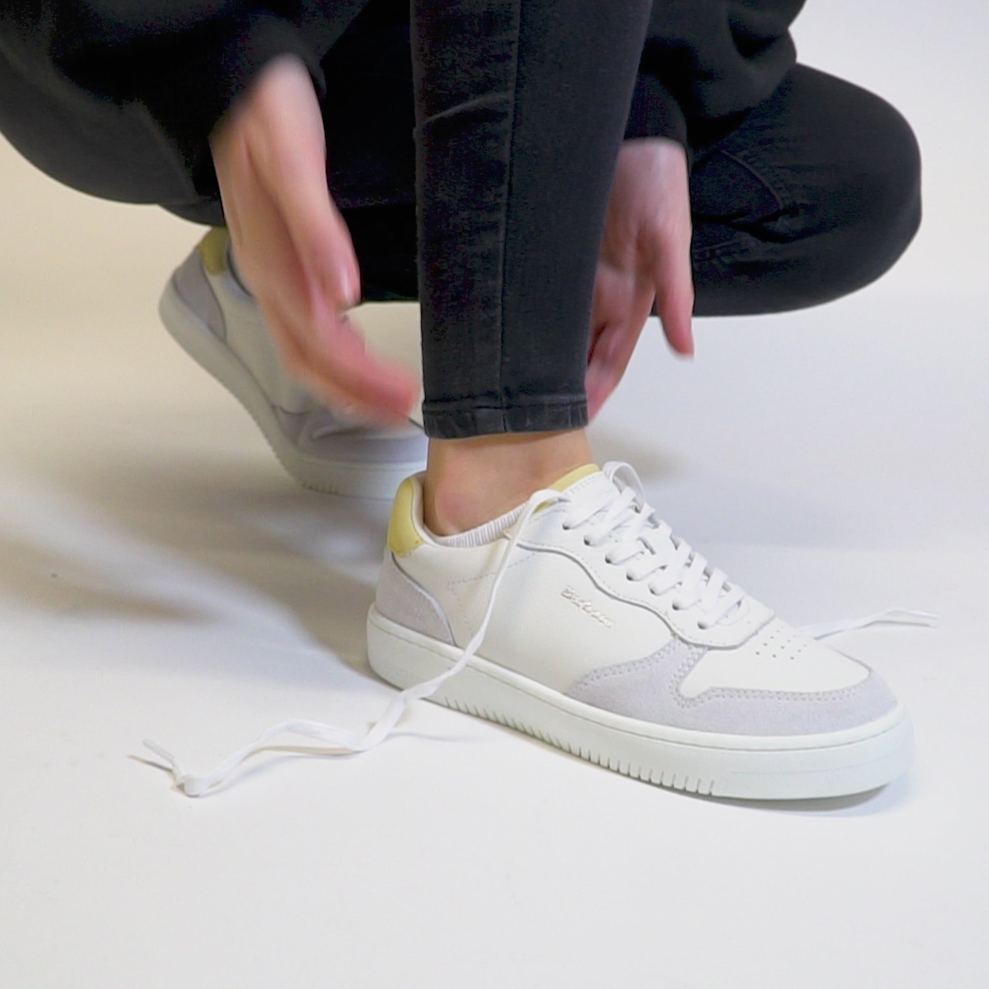 Barbour CELESTE Womens Casual Trainers White/Lemonade side view worn on foot highlighting the lace-up feature.
